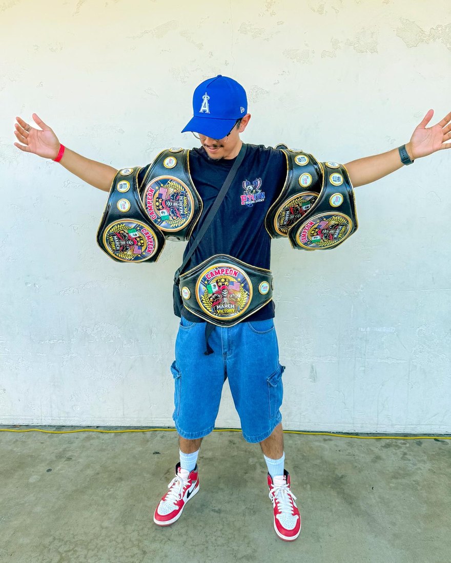 Young P-Town champion with two belts